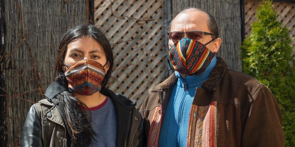 Two people wear the special-edition Uma Masks