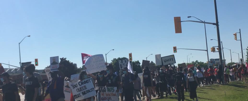 Protesters march on Hurontario Street in Brampton Ont.