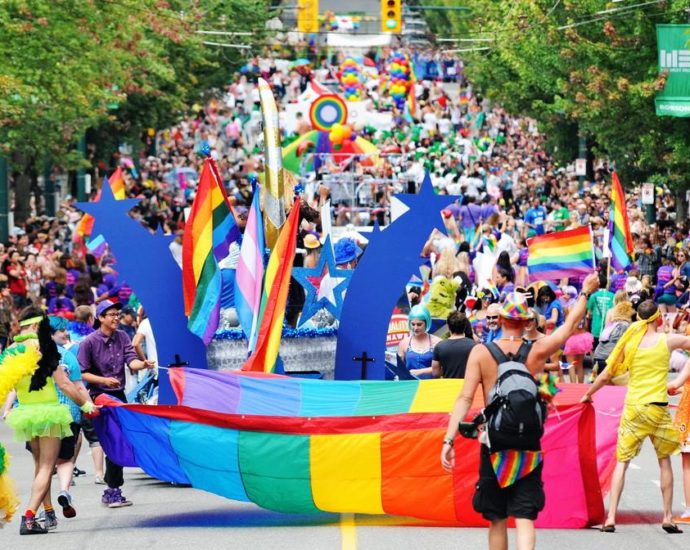 Marchers walk in the Vancouver Pride Parade