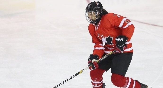 Saroya Tinker playing ice hockey for Team Canada
