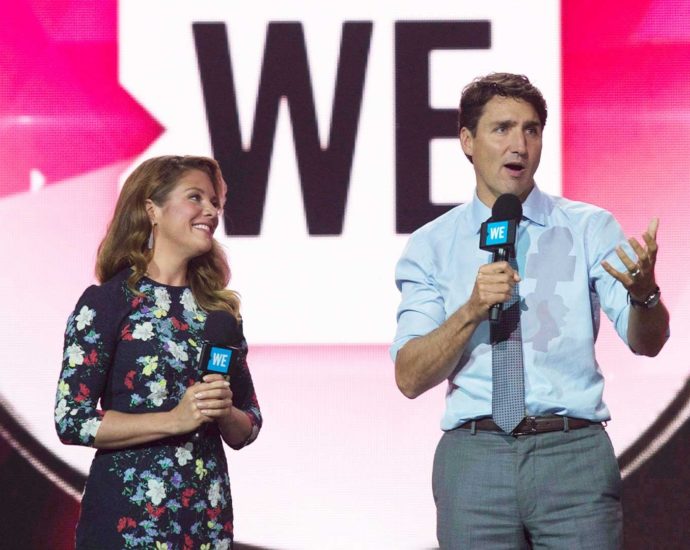 Photo of Justin Trudeau and Sophie Grégoire Trudeau speaking at a WE event