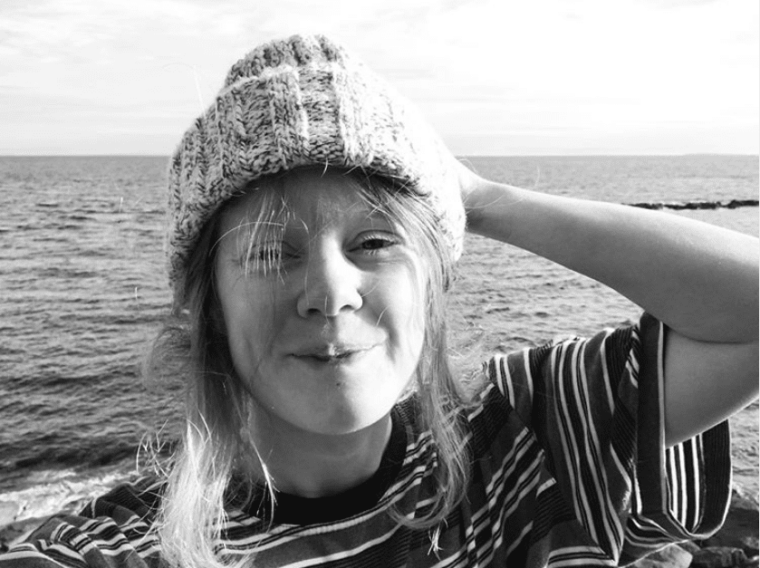 A selfie of Kerria Gray. She is wearing a knit toque and a striped t-shirt