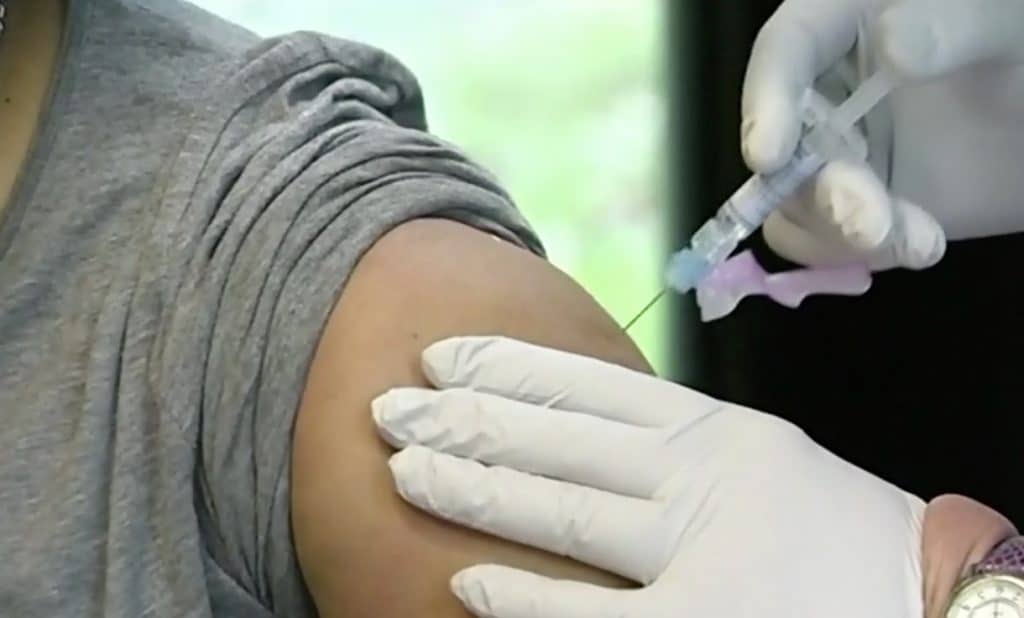 Nurse issuing covid-19 vaccine